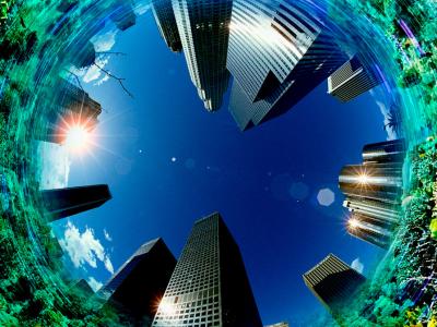 Fiskeøjeperspektiv af høje bygninger omgivet af et koralrev